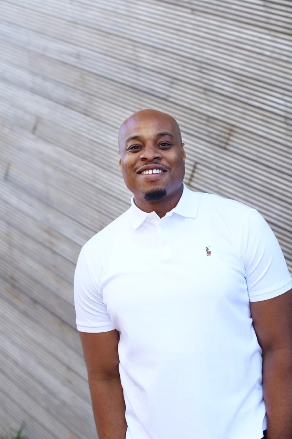 Dexter Dike, founder of Giving Care Houston, photographed warmly in natural light.